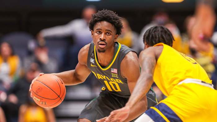 Baylor’s Adam Flagler dribbles