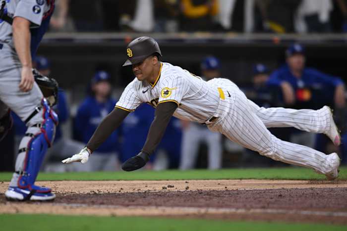 Padres Juan Soto dives for home base