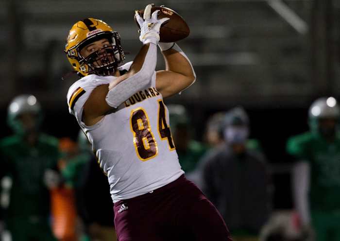 Bloomington's Aaron Steinfeldt (84) receives a pass as the Evansville North Huskies play the Bloomington North Cougars in the Class 5A Sectional 15 semifinal game at Bundrant Stadium in Evansville, Ind., Friday evening, Oct. 30, 2020.