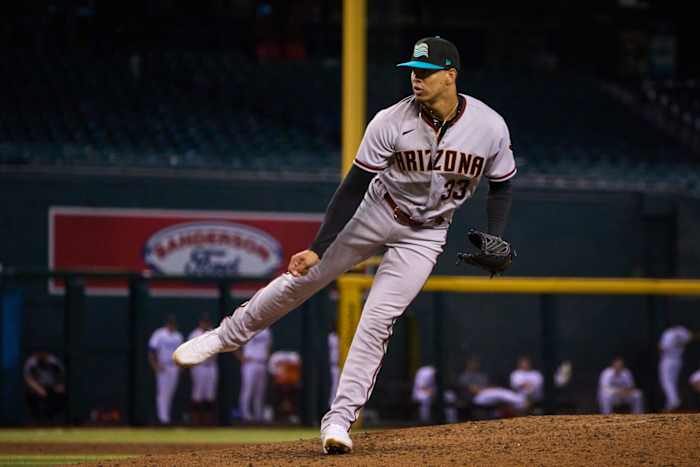 Oct 15, 2022; Phoenix, AZ, USA; Salt River Rafters pitcher Justin Martinez (33) pitches against the Surprise Saguaros at Chase Field. Mlb Dbacks Fall League Prospects