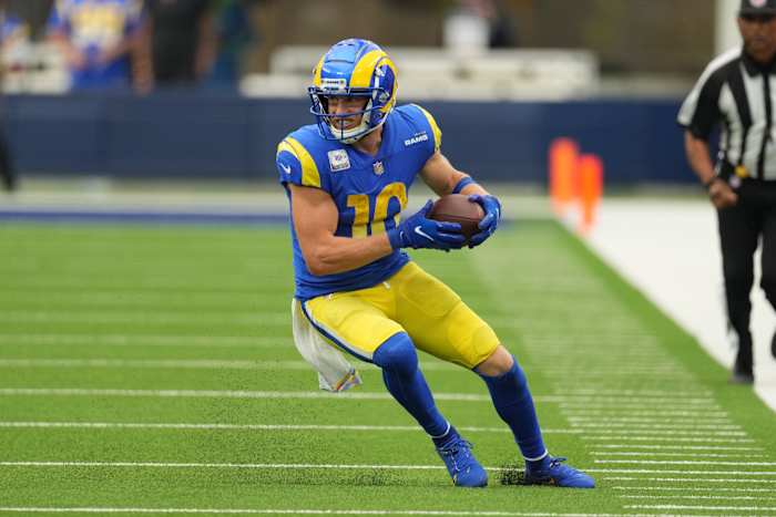 Rams wide receiver Cooper Kupp carries the ball.
