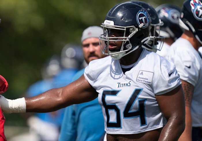 Tennessee Titans guard Nate Davis (64) runs through drills during practice at Saint Thomas Sports Park Wednesday, June 15, 2022, in Nashville, Tenn.