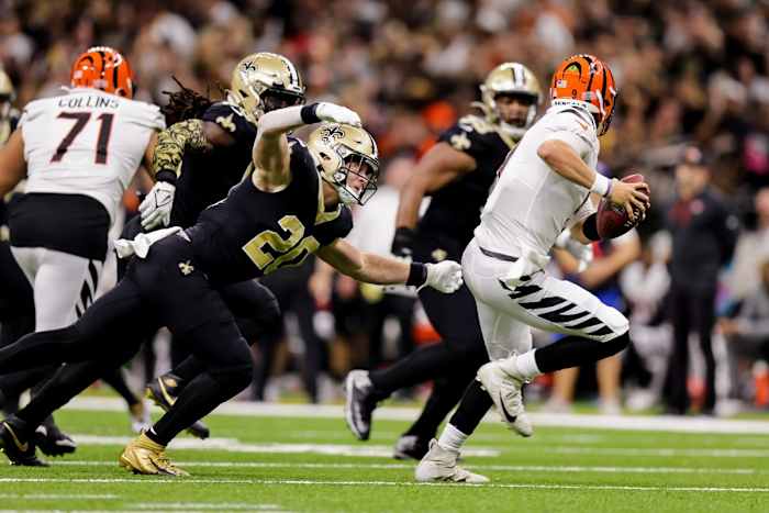 Cincinnati Bengals quarterback Joe Burrow (9) is pressured by New Orleans Saints linebacker Pete Werner (20). Mandatory Credit: Stephen Lew-USA TODAY Sports