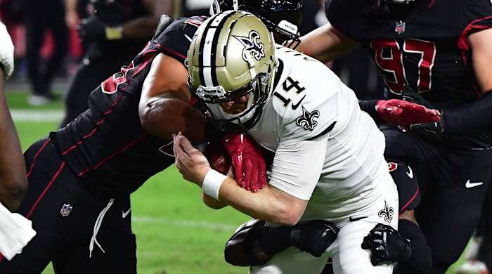 Andy Dalton gets wrapped up as the Saints lose to the Cardinals.