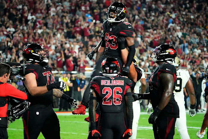 #83 Greg Dortch is lifted up into the air by his teammates after his second career touchdown