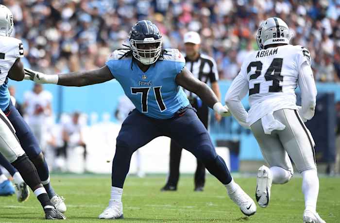 Tennessee Titans guard Dennis Daley (71) blocks against Las Vegas Raiders safety Johnathan Abram (24) during the first half at Nissan Stadium.