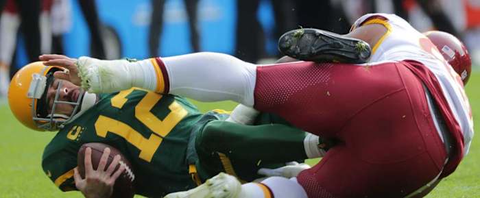 Daron Payne sacks Aaron Rodgers during last year's game. (Photo by USA Today Sports Images)