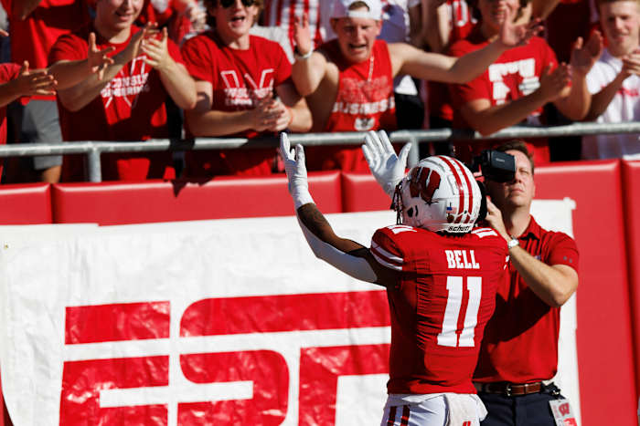 Wisconsin wide receiver Skyler Bell celebrates a touchdown with the student section.