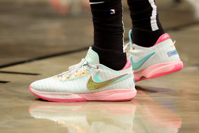 Light green and pink Nike LeBron shoes.