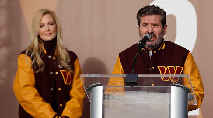 Commanders co-owners Dan (right) and Tanya (left) Snyder during a press conference.