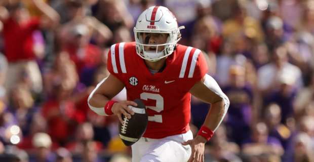 Ole Miss Rebels quarterback Jaxson Dart scrambles on a play during a college football game.