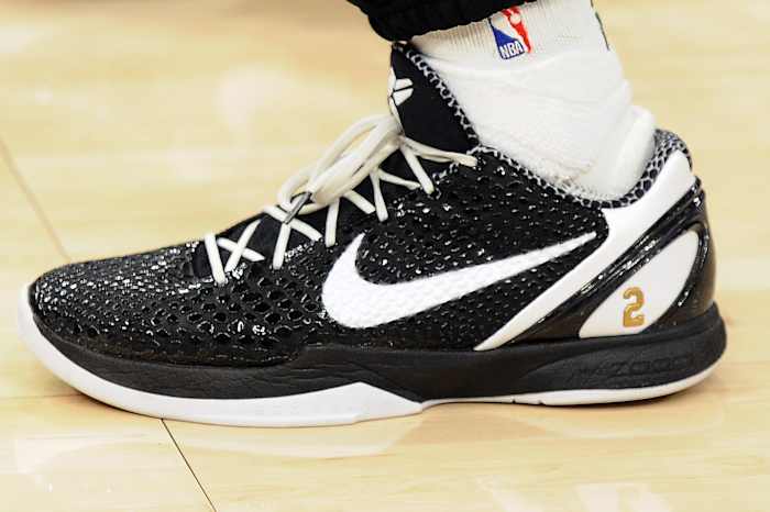 Black and white Nike Kobe shoes.