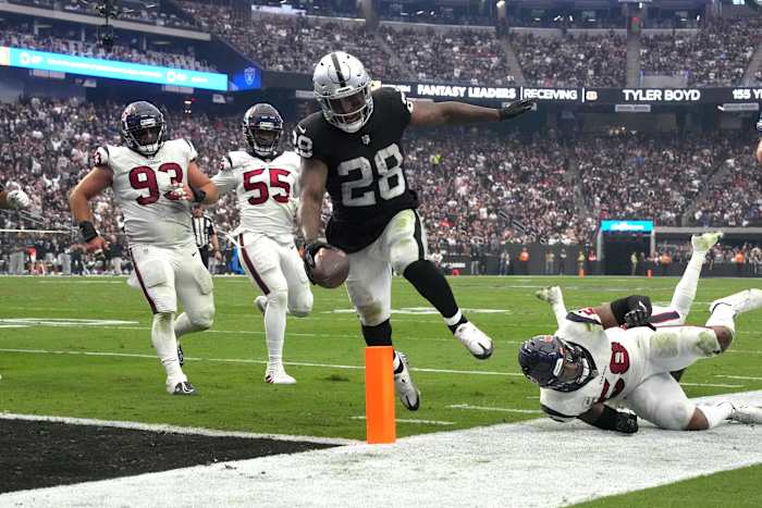Oct 23, 2022; Paradise, Nevada, USA; Las Vegas Raiders running back Josh Jacobs (28) scores on a 7-yard touchdown run in the third quarter against the Houston Texans at Allegiant Stadium. Mandatory Credit: Kirby Lee-USA TODAY Sports