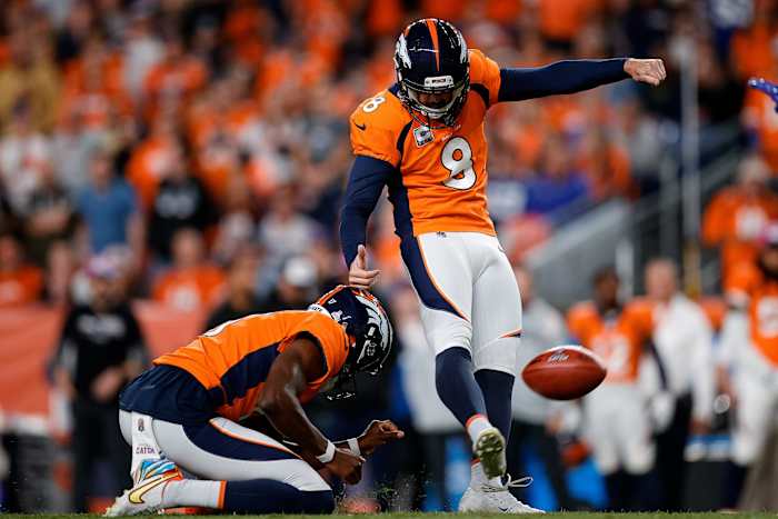 Denver Broncos place kicker Brandon McManus (8) kicks a field goal on a hold from punter Corliss Waitman (17) in the third quarter against the Indianapolis Colts at Empower Field at Mile High.