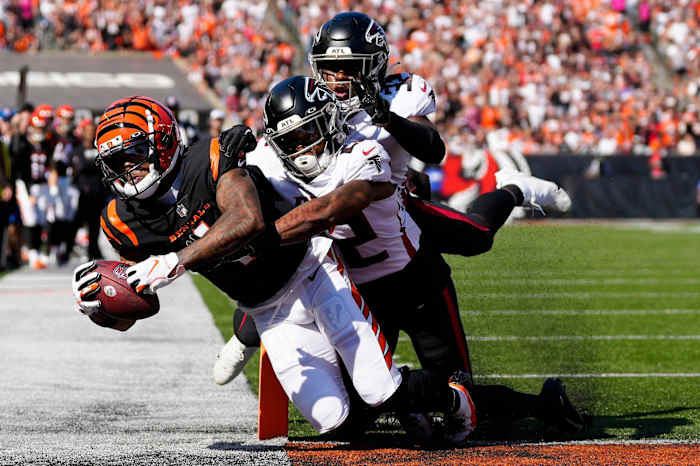 Cincinnati Bengals wide receiver Ja'Marr Chase (1) pulls in a catch for a touchdown in the second quarter of the NFL Week 7 game between the Cincinnati Bengals and the Atlanta Falcons at Paycor Stadium in downtown Cincinnati on Sunday, Oct. 23, 2022. The Bengals led 28-17 at halftime. Mandatory Credit: Sam Greene-The Enquirer Atlanta Falcons At Cincinnati Bengals Nfl Week 7