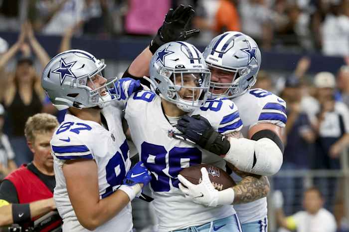 Dallas Cowboys tight end Peyton Hendershot (89) celebrates with teammates after catching a touchdown pass during the fourth quarter against the Detroit Lions at AT&T Stadium.