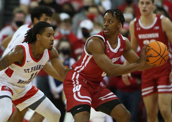Wisconsin guard Jahcobi Neath with the basketball for in the post.