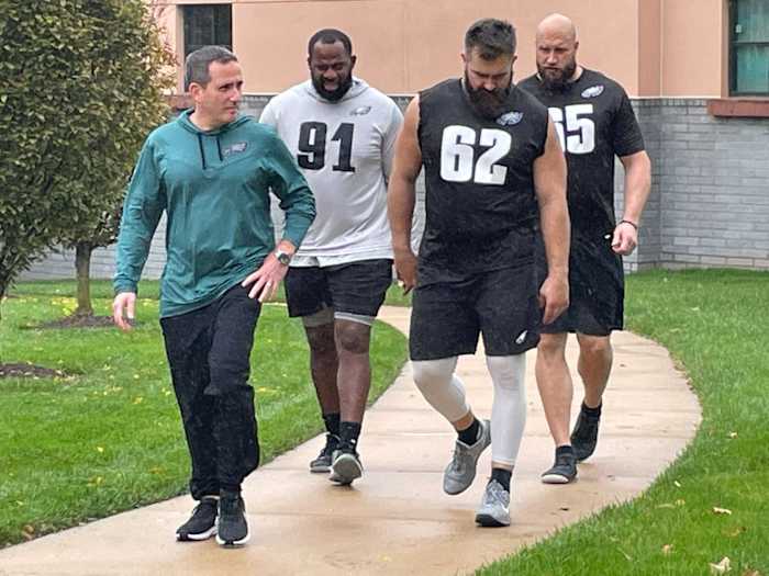 Howie Roseman with Fletcher Cox (91), Jason Kelce (62), and Lane Johnson following a walkthrough practice on Oct. 26, 2022
