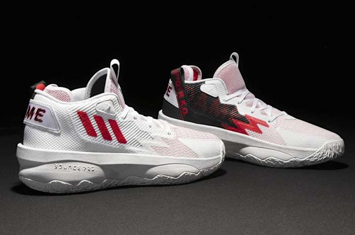 White, red, black Adidas Dame shoes.