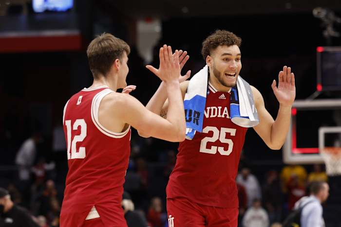 Indiana Hoosiers forward Miller Kopp (12) celebrates with Indiana Hoosiers forward Race Thompson (25) after defeating Wyoming Cowboys during the First Four of the 2022 NCAA Tournament at UD Arena.