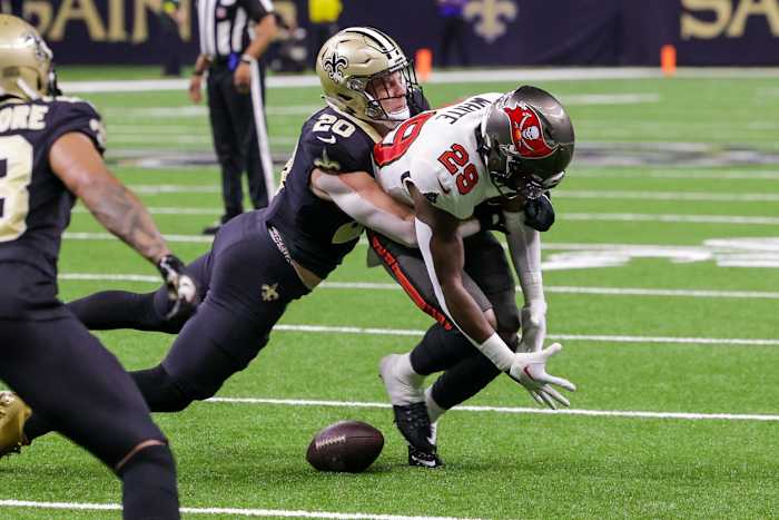 New Orleans Saints linebacker Pete Werner (20) stops Tampa Bay Buccaneers running back Rachaad White (29). Mandatory Credit: Stephen Lew-USA TODAY Sports