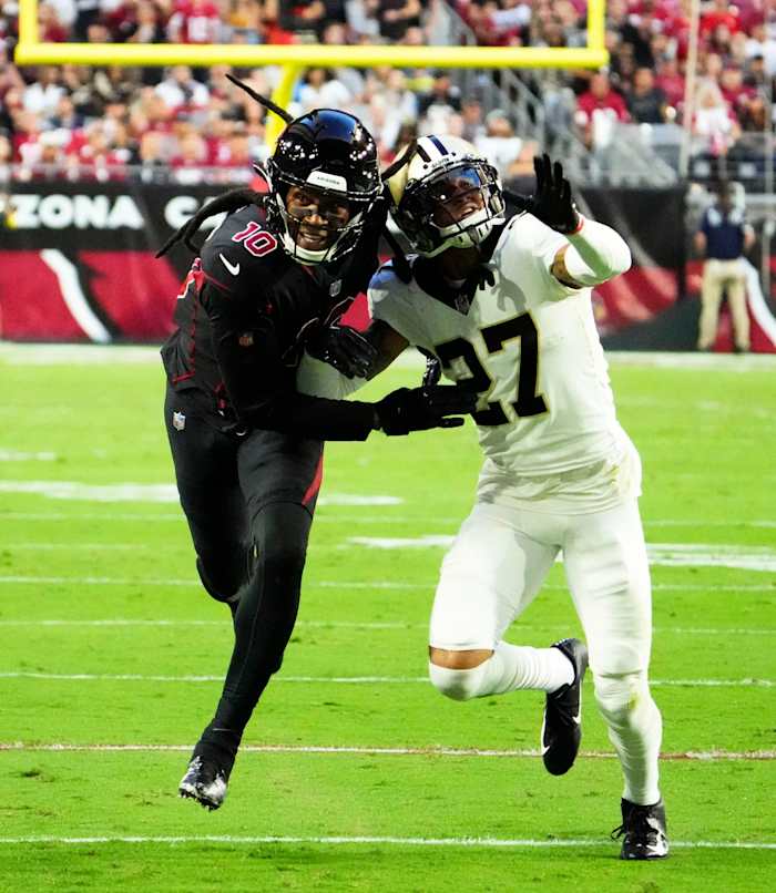 Arizona Cardinals receiver DeAndre Hopkins (10) battles for position with New Orleans Saints cornerback Alontae Taylor (27). Mandatory Credit: Rob Schumacher-Arizona Republic