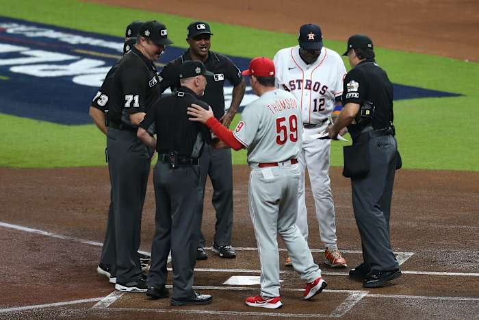 Houston Astros manager Dusty Baker (12) and Philadelphia Phillies manager Rob Thomson (59) exchange lineup cards before game one of the 2022 World Series