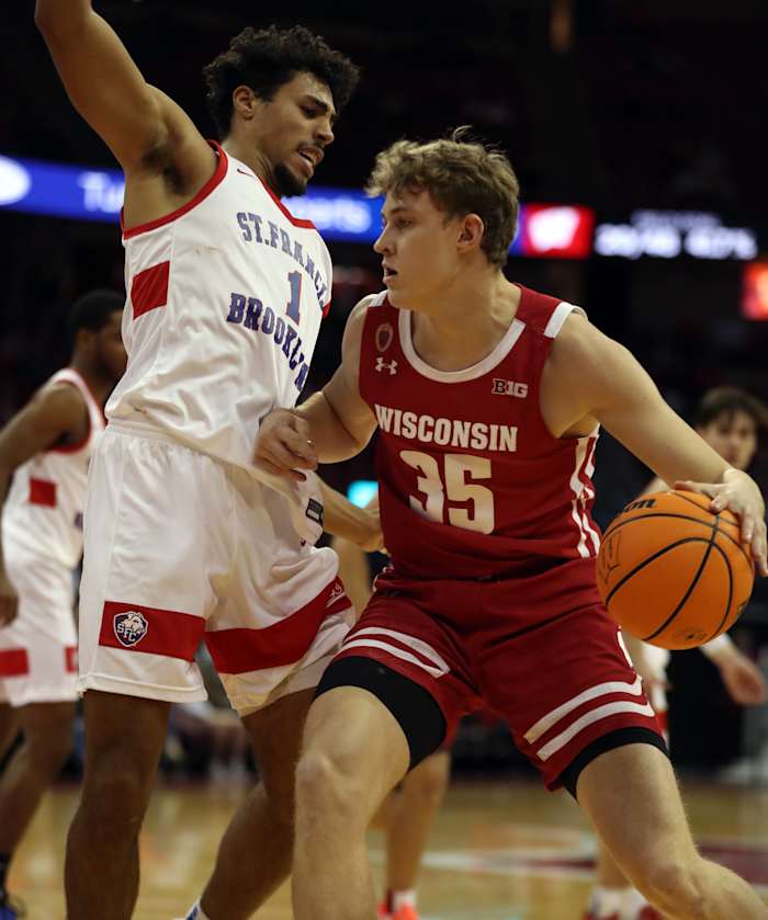 Wisconsin forward Markus Ilver backing his man down against Saint Francis of Brooklyn.