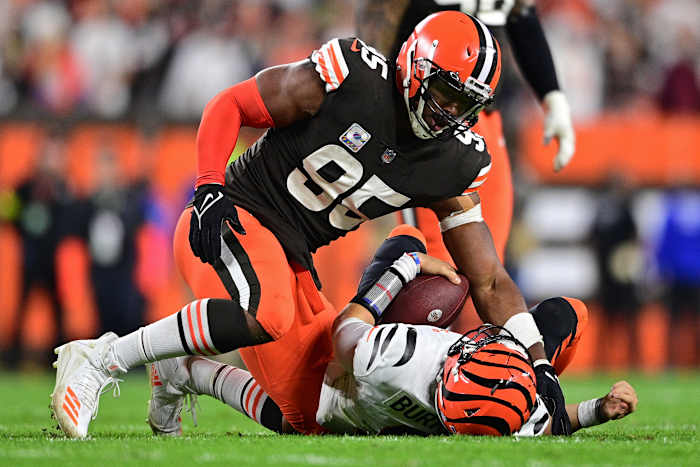 Cleveland Browns defensive end Myles Garrett (95) sacks Cincinnati Bengals quarterback Joe Burrow (9) in the fourth quarter at FirstEnergy Stadium.