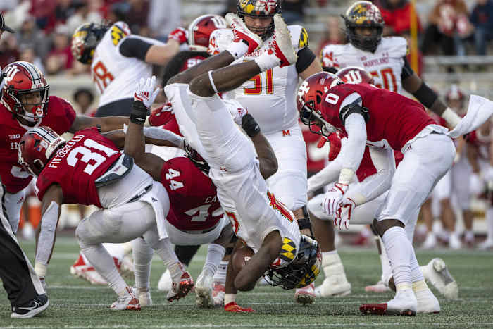 Oct 15, 2022; Bloomington, Indiana, USA; Maryland Terrapins running back Roman Hemby (24) is flipped by Indiana Hoosiers linebacker Aaron Casey (44) during the second half at Memorial Stadium.