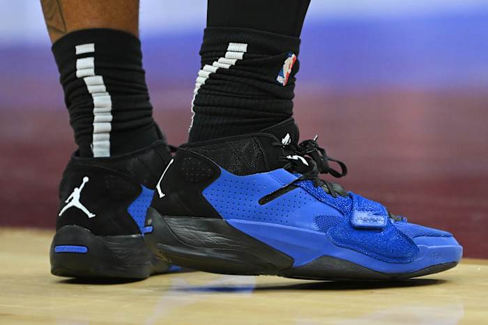 View of blue and black Zion shoes.