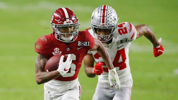 DeVonta Smith runs up field after catching a pass behind Shaun Wade