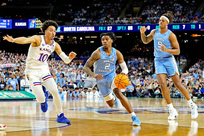 #2 Caleb Love drives to the basket in the 2022 NCAA Championship game