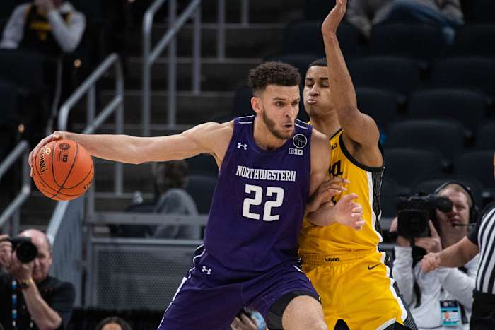 #22 Pete Nance posts up Iowa's Keegan Murray for Northwestern last season