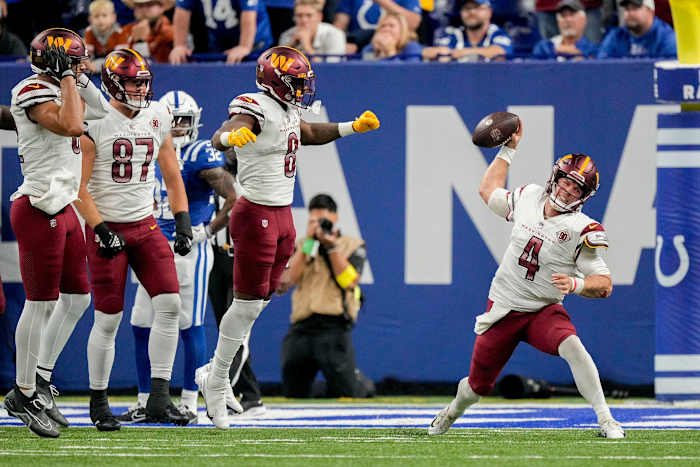 Washington Commanders quarterback Taylor Heinicke (4) spikes the ball after a game-tying touchdown Sunday, Oct. 30, 2022, during a game against the Indianapolis Colts at Indianapolis Colts at Lucas Oil.