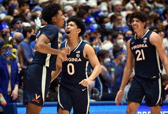 #0 Kihei Clark celebrates with teammates #2 Reece Beekman and #21 Kadin Shedrick