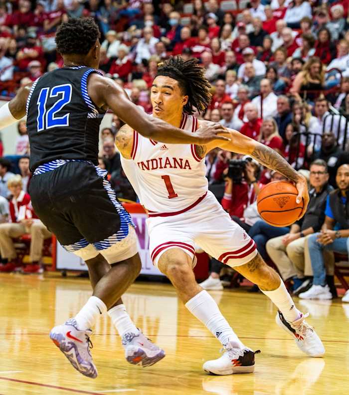 Indiana's Jalen Hood-Schifino (1) goes around his back to get past St. Francis' Antwaan Cushingberry (12) during the Indiana versus St. Francis men's basketball game at Simon Skjodt Assembly Hall on Thursday, Nov. 3, 2022.