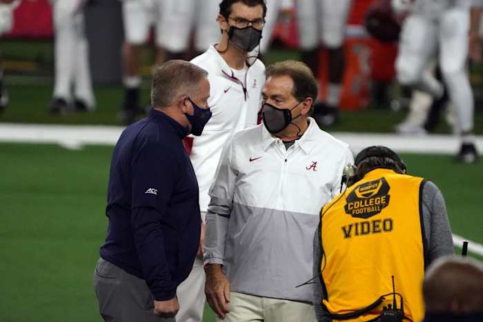 Jan 1, 2021; Arlington, TX, USA; Alabama Crimson Tide head coach Nick Saban and Notre Dame Fighting Irish head coach Brian Kelly meet on the field before the Rose Bowl at AT&T Stadium. Mandatory Credit: Kirby Lee-USA TODAY Sports