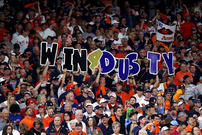 Astros fans hold up signs to support manager Dusty Baker