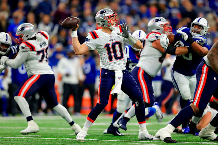 New England Patriots quarterback Mac Jones passes during an NFL game against the Indianapolis Colts on Saturday, Dec. 18, 2021, at Lucas Oil Stadium in Indianapolis.