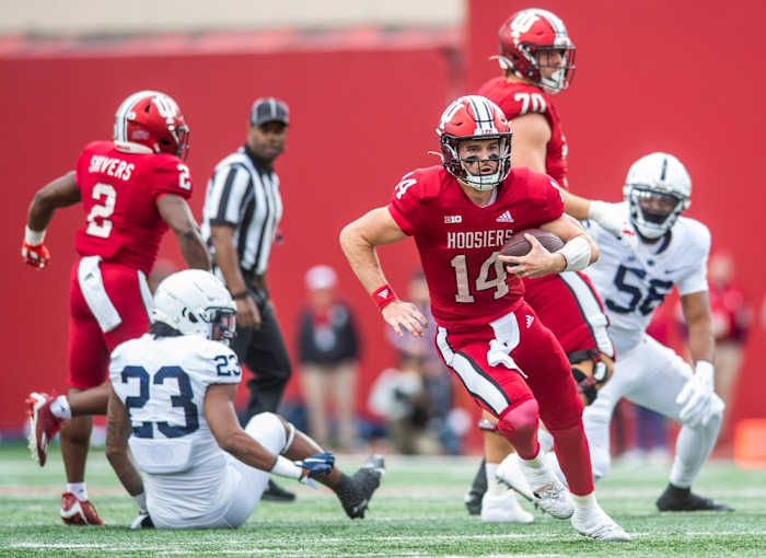 Indiana's Jack Tuttle (14) runs during the first half of the Indiana versus Penn State football game at Memorial Stadium on Satruday, Nov. 5, 2022.