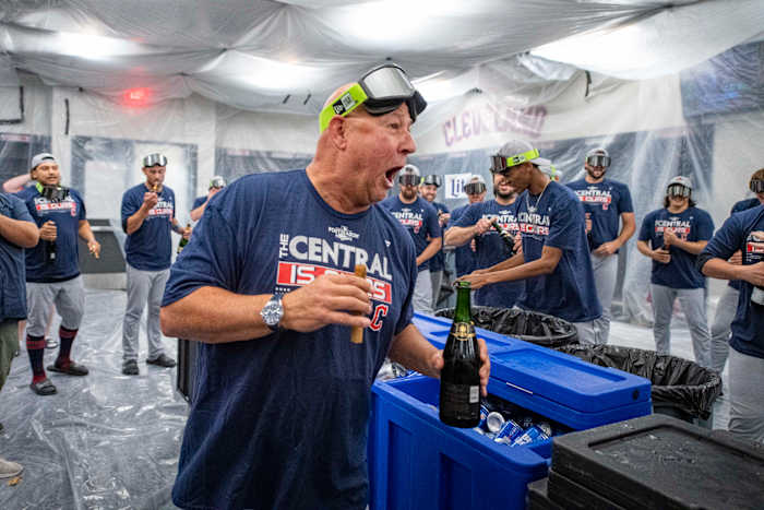 Sep 25, 2022; Arlington, Texas, USA; Cleveland Guardians manager Terry Francona (77) celebrates with his team in the locker room after the Guardians clinch their first AL Central title since 2018 after the victory over the Texas Rangers at Globe Life Field. Mandatory Credit: Jerome Miron-USA TODAY Sports