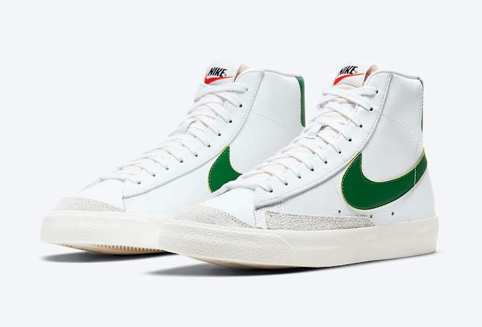 White and green Nike Blazer shoes.
