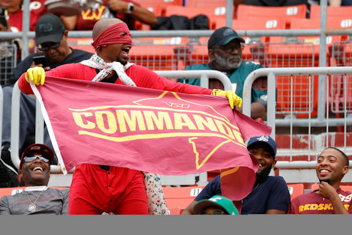 Washington Commanders fans cheer on their team at FedEx Field.