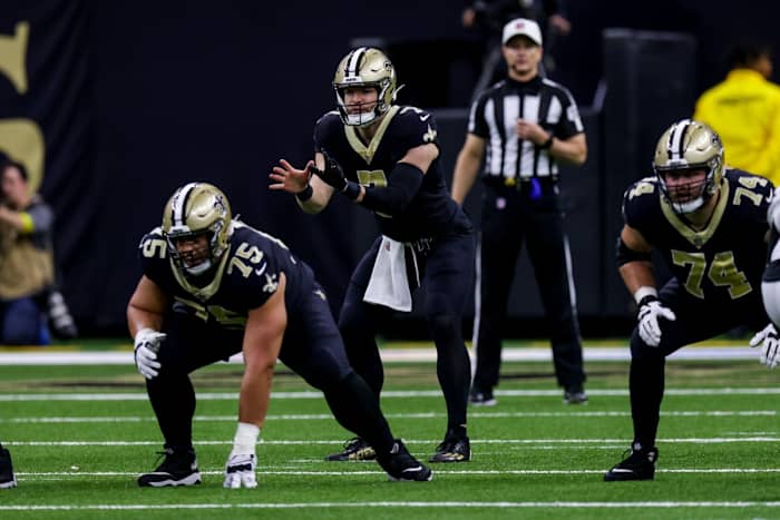 New Orleans Saints offensive linemen James Hurst (74) and Andrus Peat (75) block for Taysom Hill (7) against the Cincinnati Bengals. Mandatory Credit: Stephen Lew-USA TODAY Sports
