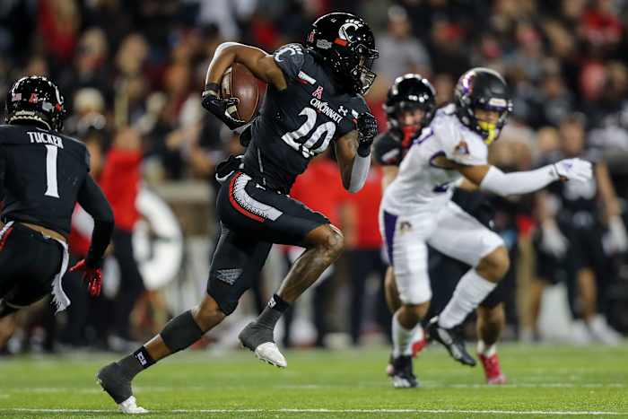 Nov 11, 2022; Cincinnati, Ohio, USA; Cincinnati Bearcats wide receiver Jadon Thompson (20) returns the kick off and runs it for a touchdown against the East Carolina Pirates in the first half at Nippert Stadium. Mandatory Credit: Katie Stratman-USA TODAY Sports