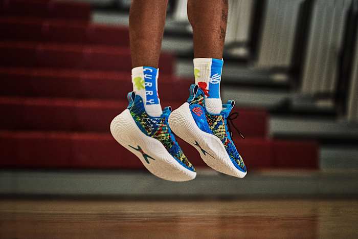 View of blue and white Curry shoes.