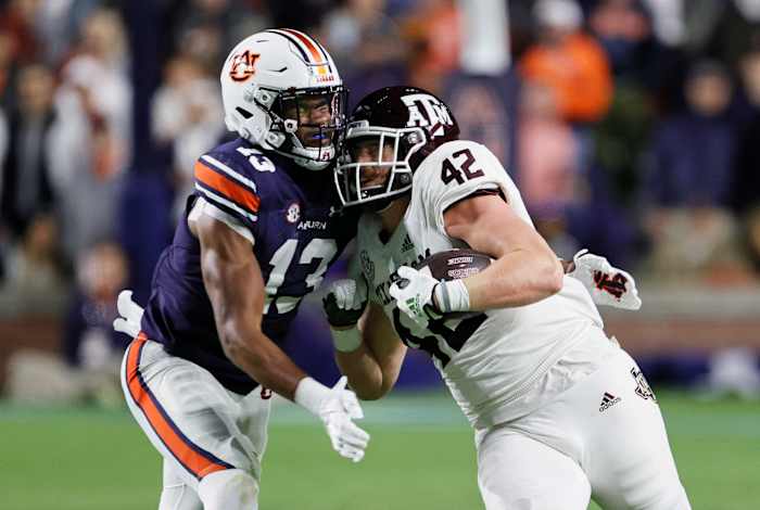 Nov 12, 2022; Auburn, Alabama, USA; Texas A&M Aggies tight end Max Wright (42) is tackled by Auburn Tigers linebacker Cam Riley (13) during the second quarter at Jordan-Hare stadium. Mandatory Credit: John Reed-USA TODAY Sports