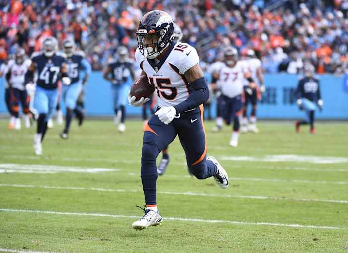Denver Broncos wide receiver Jalen Virgil (15) runs for a touchdown after a reception during the first half against the Tennessee Titans at Nissan Stadium.