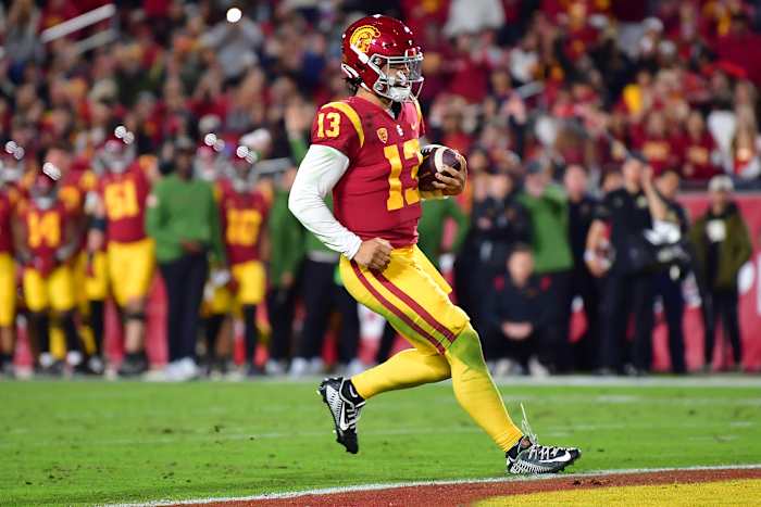 Trojans quarterback Caleb Williams scores a rushing touchdown